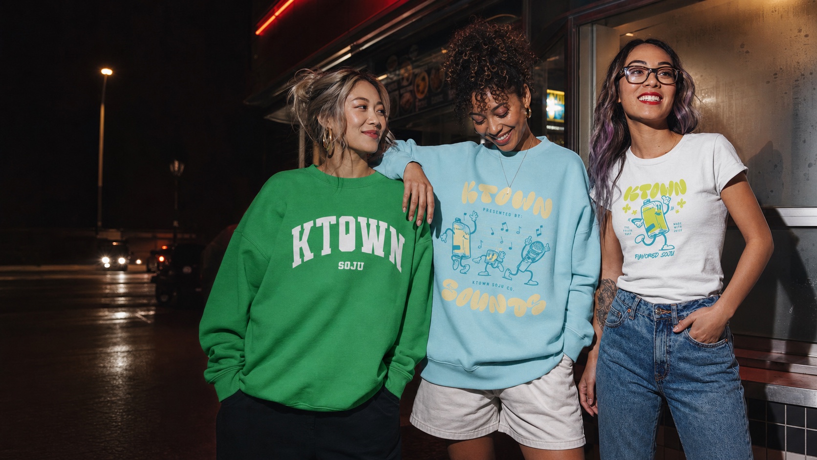 Friends wearing colorful KTOWN apparel outside a late-night diner